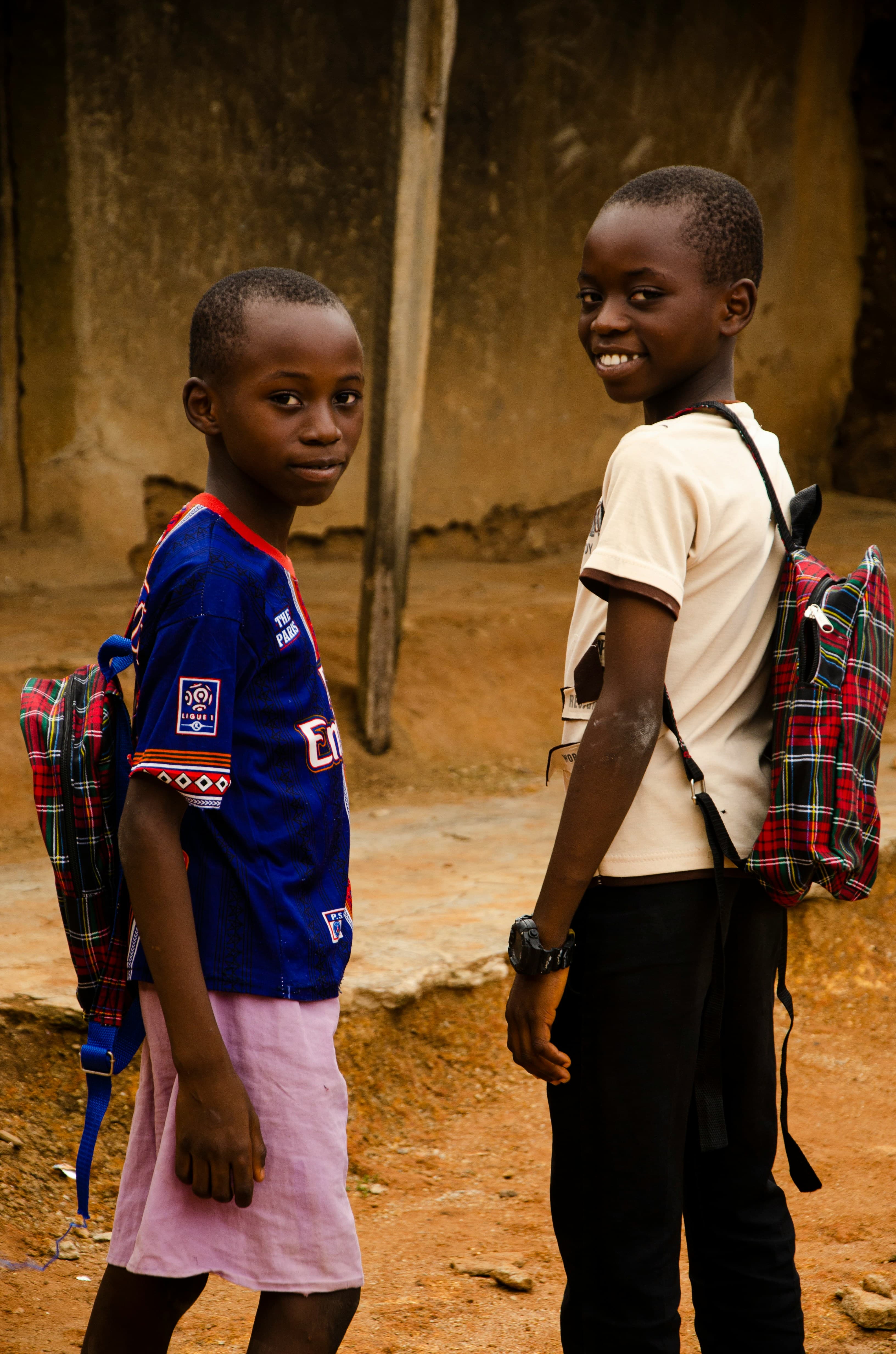 Young Ghanaian school students with backpacks